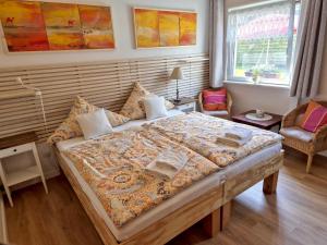 a bedroom with a large bed in a room at Alte Schmiede Putbus in Putbus