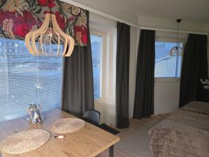 En eller flere senge i et værelse på Arctic City Base apartment