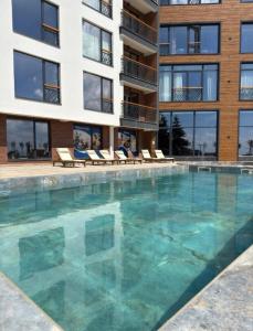 a large swimming pool in front of a building at B8 Residence hill in Kopaonik