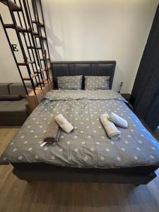 a bedroom with a bed with two towels on it at B8 Residence hill in Kopaonik +26 photos