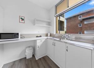 Kuchyň nebo kuchyňský kout v ubytování Perth CBD Retreat