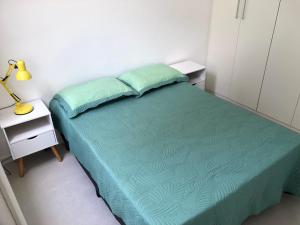 Postel nebo postele na pokoji v ubytování No melhor ponto do Flamengo, conforto e segurança no Rio