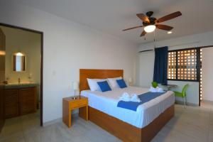 Postel nebo postele na pokoji v ubytování Yuum Ha Boutique Hotel