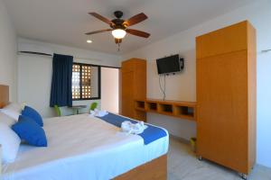 Postel nebo postele na pokoji v ubytování Yuum Ha Boutique Hotel