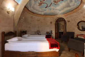 Postel nebo postele na pokoji v ubytování Artium Cave Hotel