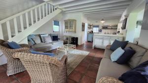 a living room with a couch and a table at The Ark Holiday Home in Stanford