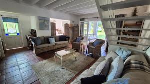 a living room with a couch and a table at The Ark Holiday Home in Stanford