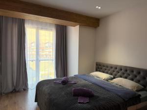 Giường trong phòng chung tại Gudauri Mountain View Studio