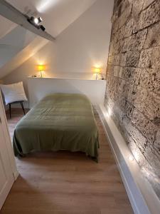 Ένα ή περισσότερα κρεβάτια σε δωμάτιο στο Les ducs de Normandie