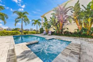 a swimming pool in the backyard of a home at LC517T The Chic Abode at Liberty Bluff in Kissimmee