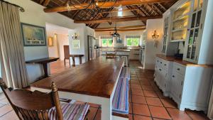 a large kitchen with a large wooden table in it at Coppull Private Nature Reserve in Stanford