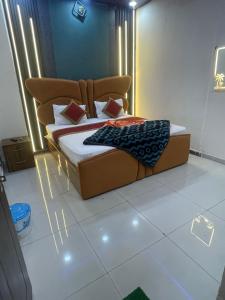 a bed in a room with lights on the floor at Hotel Himalayan Residency in Jāmb