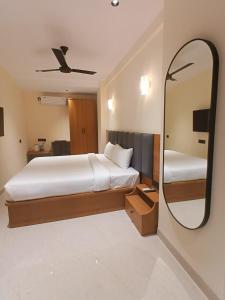 Ένα ή περισσότερα κρεβάτια σε δωμάτιο στο BAELTREE HOTEl