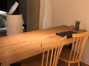 a wooden table with a laptop on top of it at 여성전용1인숙소 Milli Home 