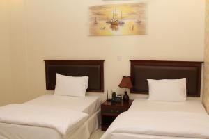 Postel nebo postele na pokoji v ubytování Dar Al Khaleej Hotel Apartments + 37 fotografií