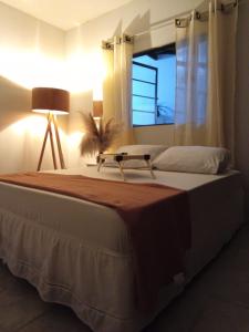 a bedroom with a large bed and a window at Pousada São Jorge in Araxá +35 photos