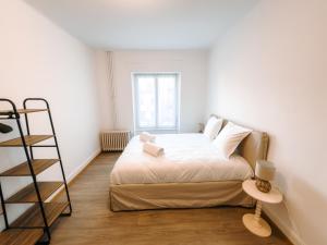 En eller flere senge i et værelse på Appartement Hyper Centre Moderne - French Luxury
