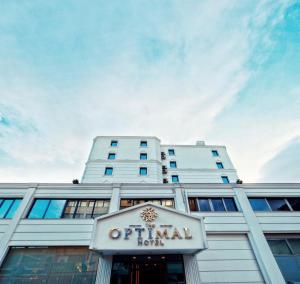 an office building with a sign in front of it at Optimal Hotel in Bursa