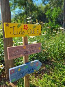 a sign that says jungle one c and a garden at Pousada dos Sonhos - Timbé do Sul in Timbe do Sul