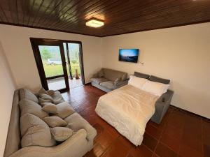 Ένα ή περισσότερα κρεβάτια σε δωμάτιο στο Paraíso no Campo - Lago, Festa e Hospedagem