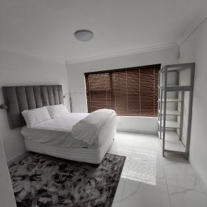 Postel nebo postele na pokoji v ubytování Cozy Home