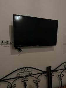 a flat screen tv hanging on a wall at Nene' in Fasano