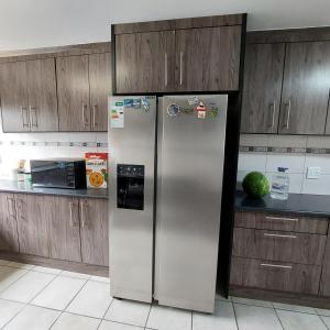 Kuchyň nebo kuchyňský kout v ubytování Cozy Home