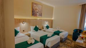 Ένα ή περισσότερα κρεβάτια σε δωμάτιο στο فندق بونسيانا - Poinciana Hotel +22 φωτογραφίες