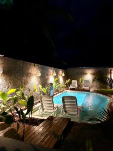 Bazén v ubytování Arraia Suítes Pousada nebo v jeho okolí