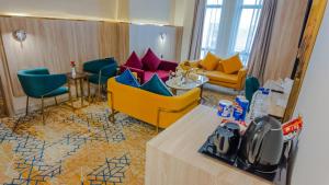 Χώρος καθιστικού στο فندق بونسيانا - Poinciana Hotel