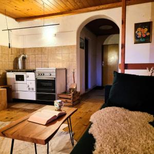 a living room with a couch and a table at Alpine Auszeit am Wilden Kaiser in Scheffau am Wilden Kaiser +19 photos