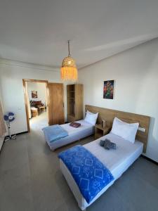 Ένα ή περισσότερα κρεβάτια σε δωμάτιο στο Atlantic view Tamraght 2 +33 φωτογραφίες