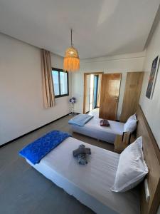 Ένα ή περισσότερα κρεβάτια σε δωμάτιο στο Atlantic view Tamraght 2