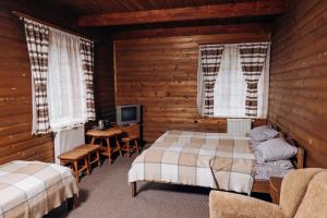 Postel nebo postele na pokoji v ubytování Готель Пацьорка + 149 fotografií