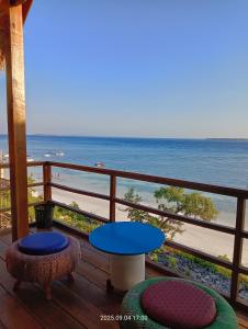a balcony with a view of the beach at Casablanca Bira Resort in Tabutule