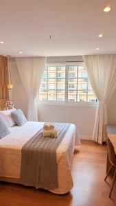 En eller flere senge i et værelse på Granja Brasil - Lindo Studio - Com Piscina e Lazer - No Centro de Itaipava