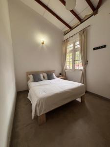 Ένα ή περισσότερα κρεβάτια σε δωμάτιο στο Villa Aureia