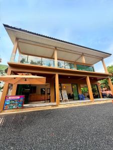 a building with an umbrella on the side of it at Pure Sand Lanta Resort in Ko Lanta