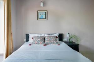 Postel nebo postele na pokoji v ubytování Lilac Homes