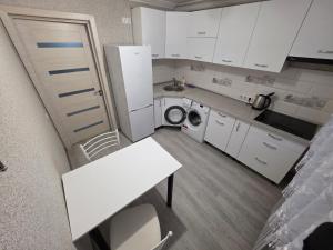 Kuchyň nebo kuchyňský kout v ubytování Buiucani