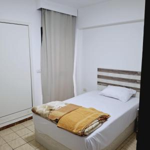 Ένα ή περισσότερα κρεβάτια σε δωμάτιο στο Cali Residence