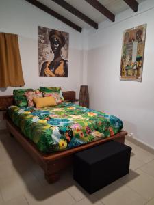 Ένα ή περισσότερα κρεβάτια σε δωμάτιο στο Ti Édèn