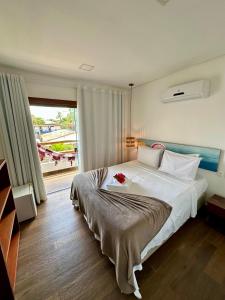 Postel nebo postele na pokoji v ubytování Arraia Suítes Pousada