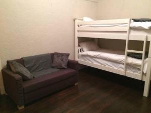 a living room with a couch and a bunk bed at The Haven Cottage in Slamannan