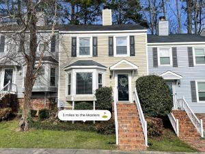 a house with a sign that says smiles to the wolves at Azalea: 2 primary bedrooms w/ bathrooms in Augusta