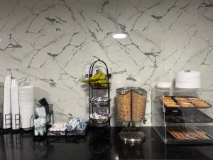 a counter with some food and a bunch of food at Roseville Inn in Roseville