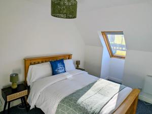 En eller flere senge i et værelse på Littlebay Penthouse