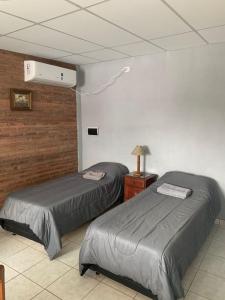 En eller flere senge i et værelse på LA TRANQUERA DPTOS + 4 billeder
