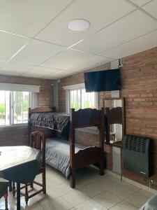 En eller flere senge i et værelse på LA TRANQUERA DPTOS