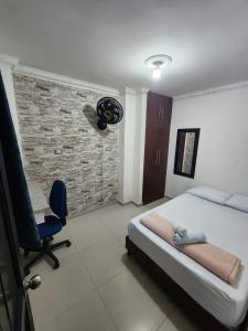 Postel nebo postele na pokoji v ubytování Hostal SHELTER LA PERLA - San luis, Antioquia, Colombia